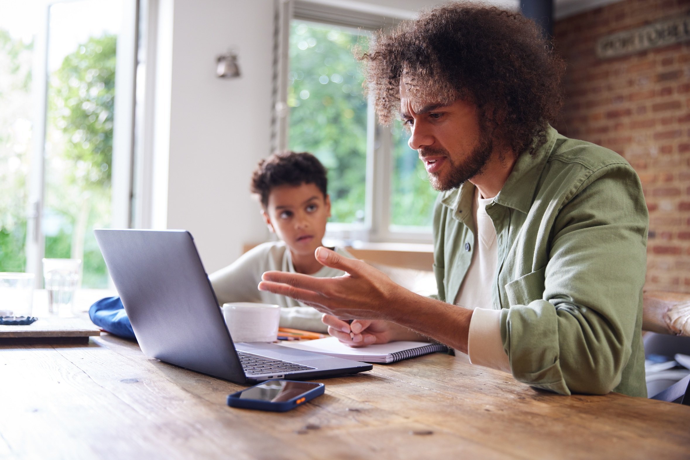 adult-assisting-a-child-with-online-learning-2026-03-15-23-25-54-utc