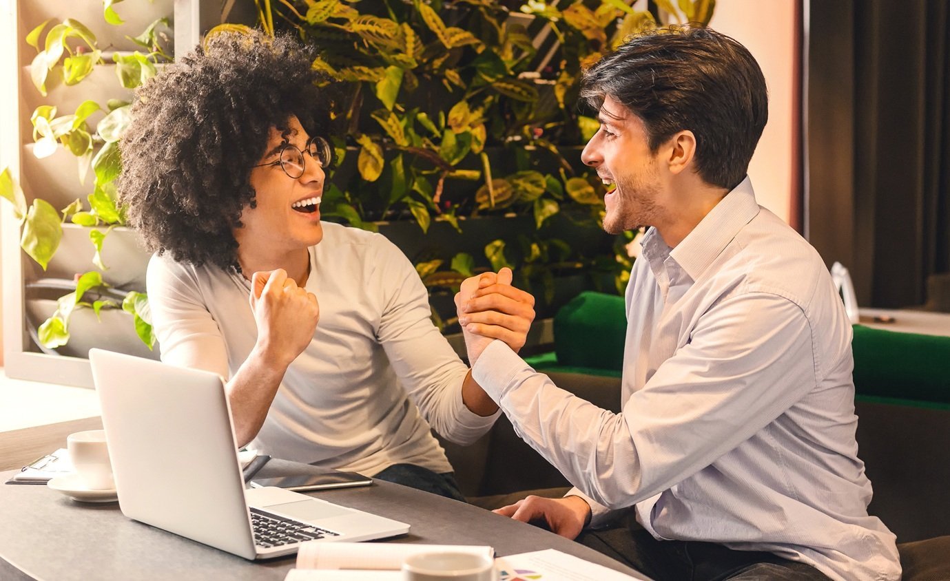 cheerful-colleagues-celebrating-success-in-a-moder-2026-03-24-02-22-32-utc