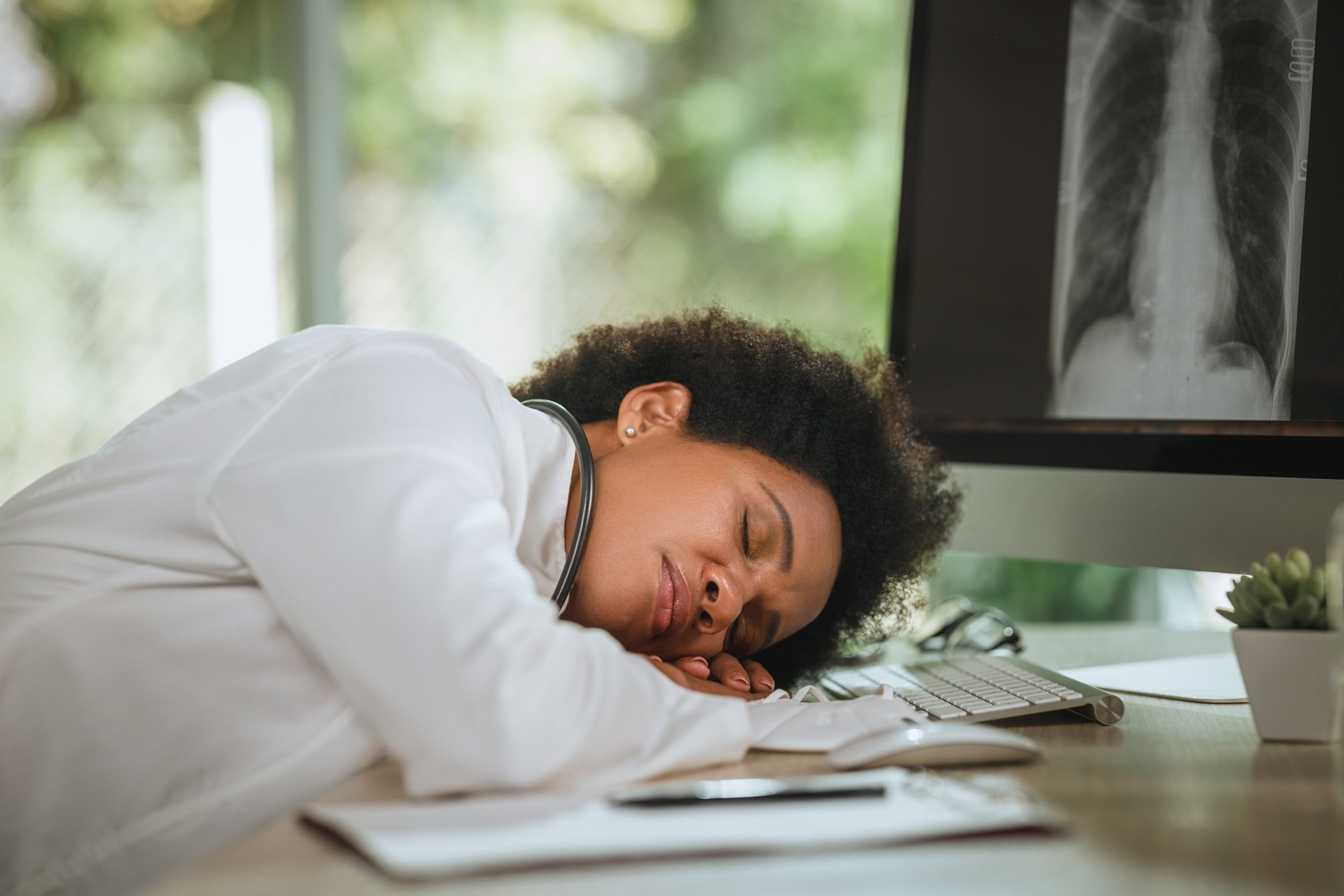 exhausted-woman-sleeping-at-desk-in-office-2026-03-10-04-50-54-utc