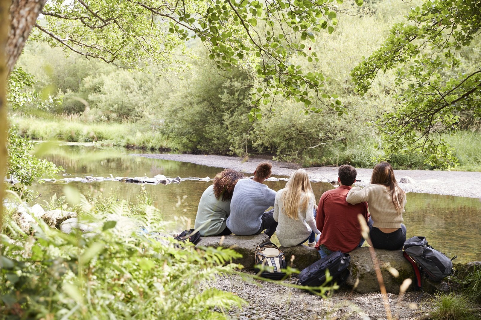 five-young-adult-friends-taking-a-break-sitting-on-2026-01-05-06-27-34-utc