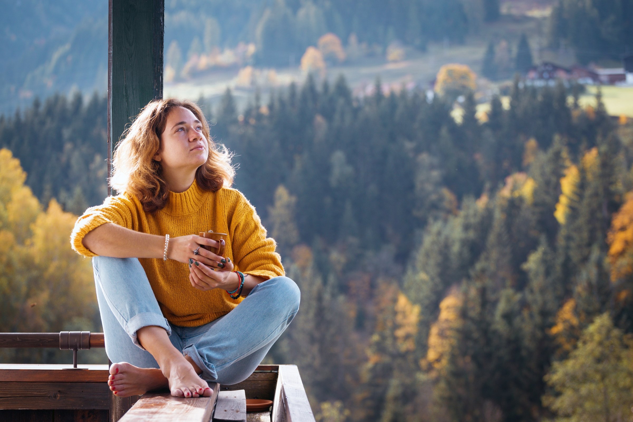 girl-with-a-cup-of-coffee-sitting-on-the-railing-o-2026-01-11-08-51-46-utc