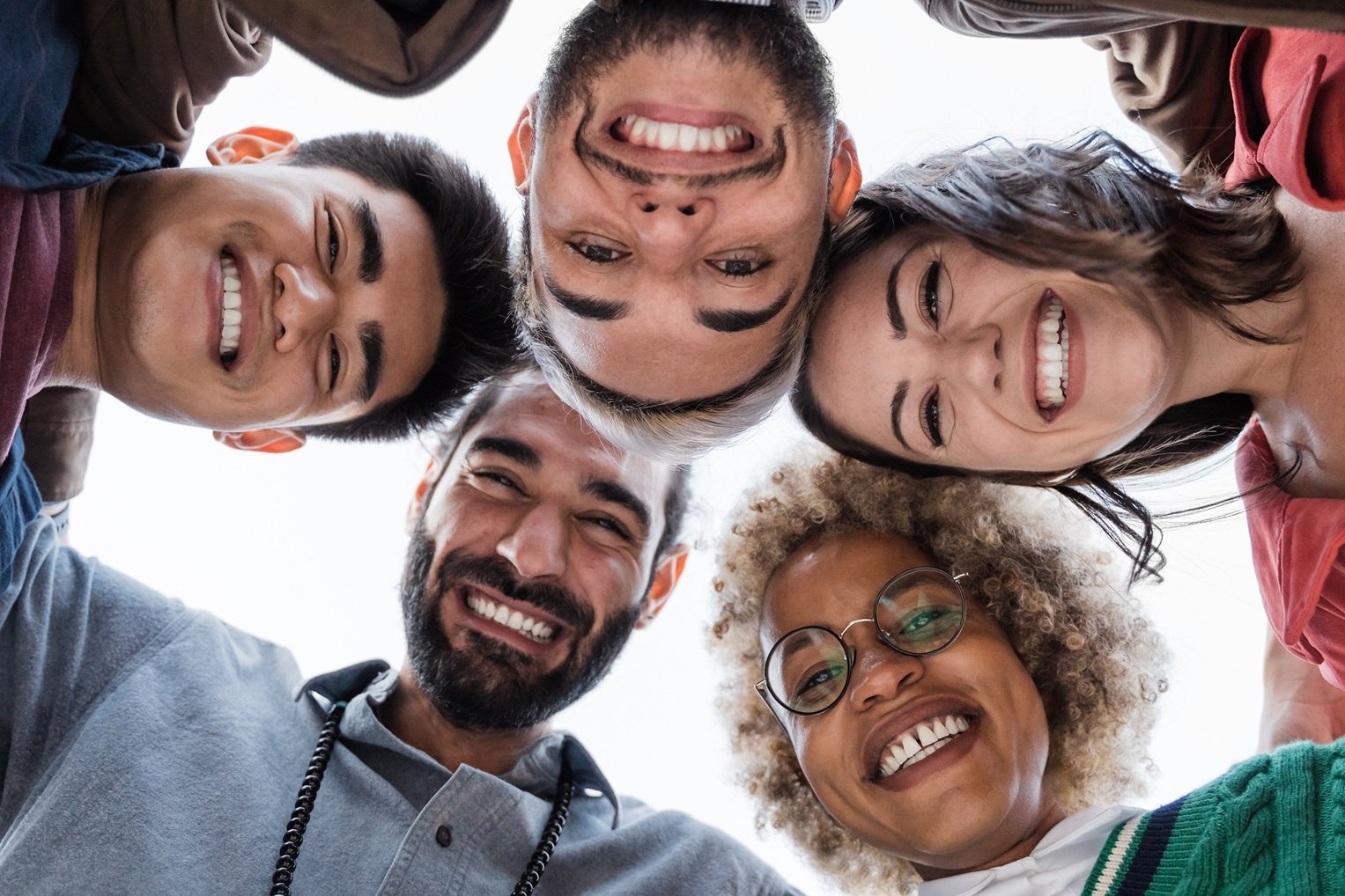 group-of-diverse-friends-hugging-in-circle-happy-2026-01-08-05-00-43-utc