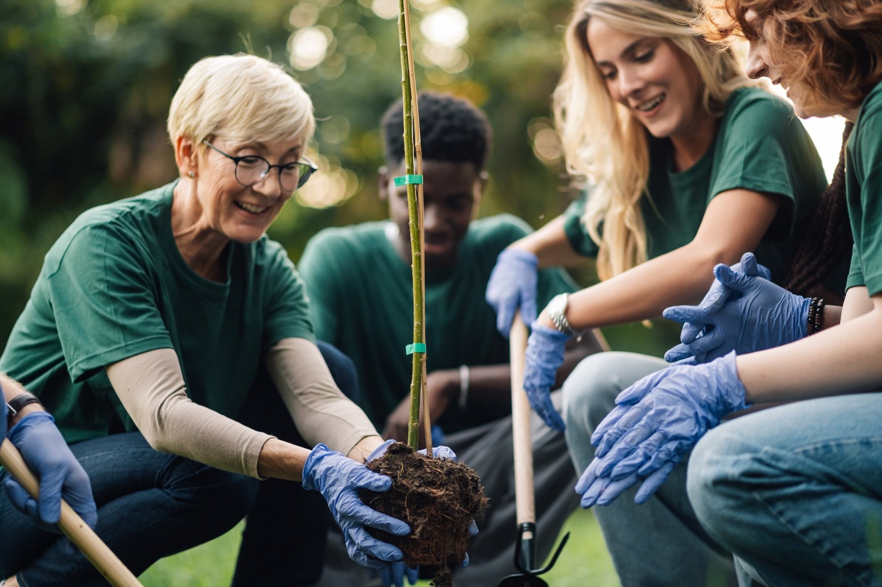 happy-volunteers-planting-a-tree-in-the-park-2026-01-09-11-07-55-utc