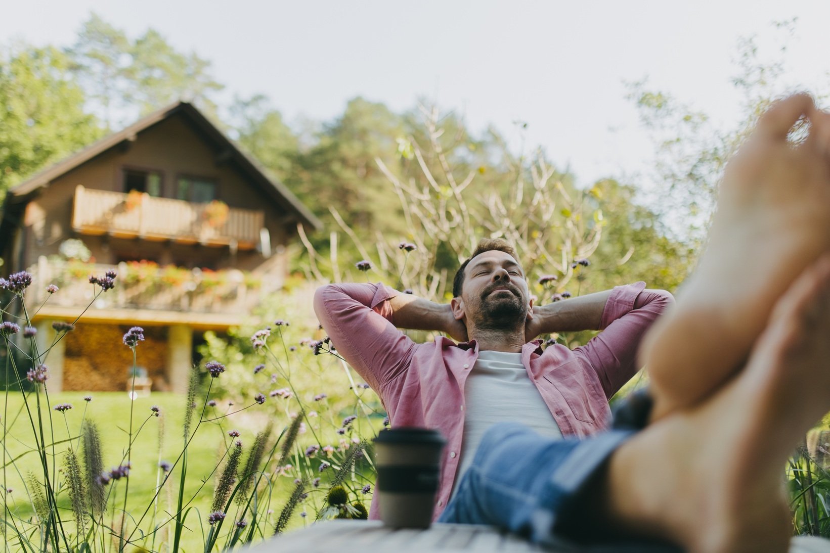 relaxed-man-sitting-in-the-garden-with-feet-on-tab-2026-03-10-03-20-39-utc