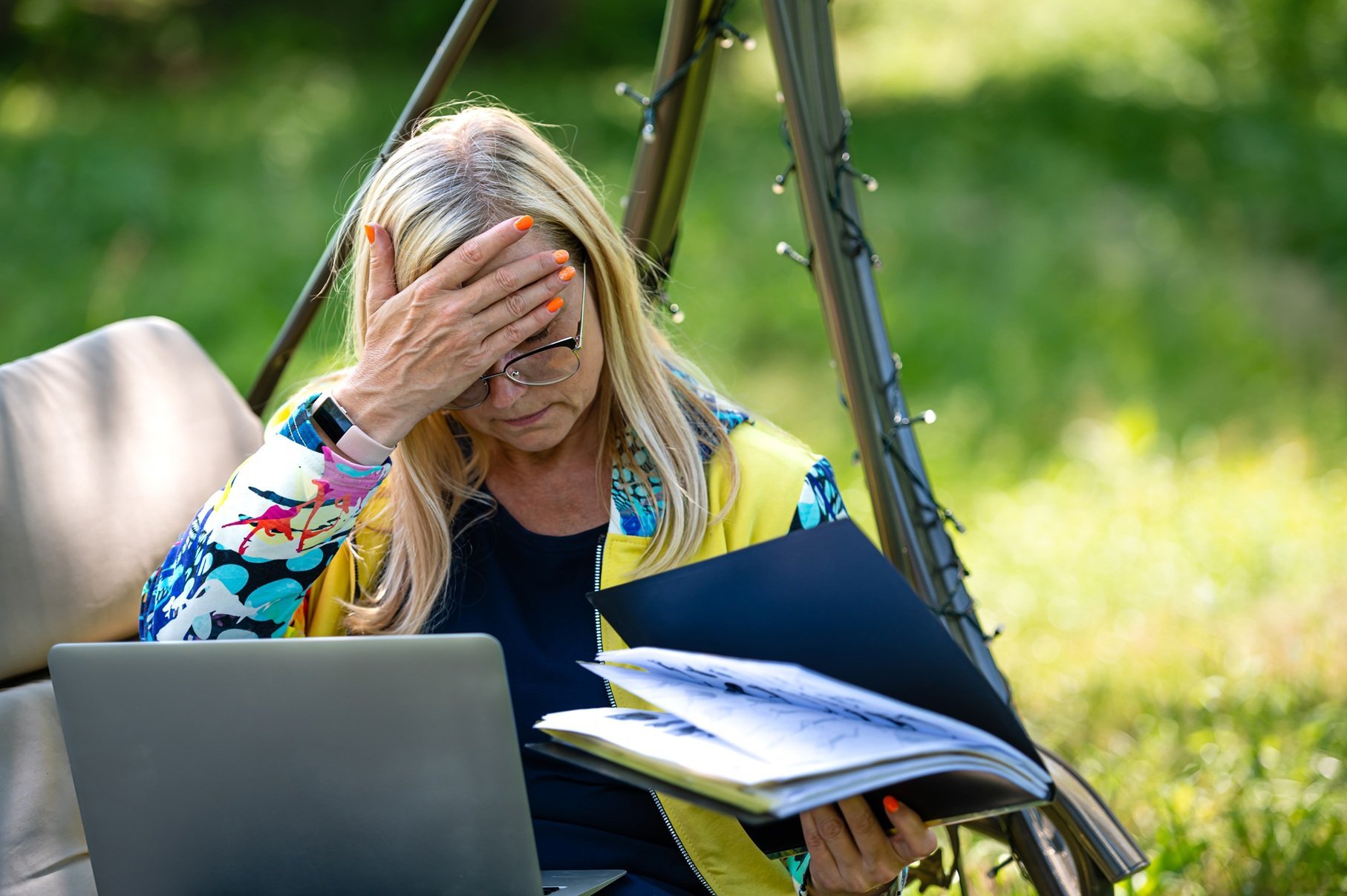 senior-woman-with-laptop-and-documents-working-in-2026-03-24-07-41-46-utc