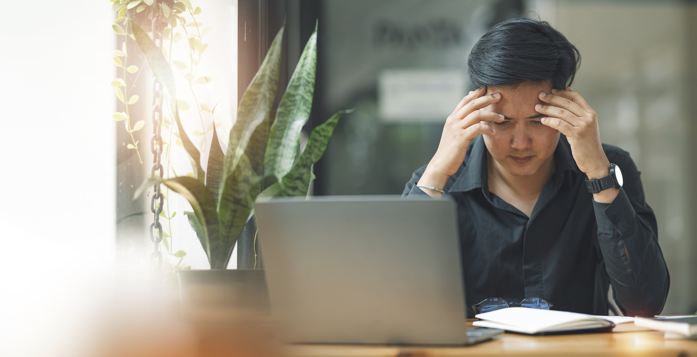 stressed-businessman-with-laptop-computer-sitting-2026-01-07-02-06-20-utc
