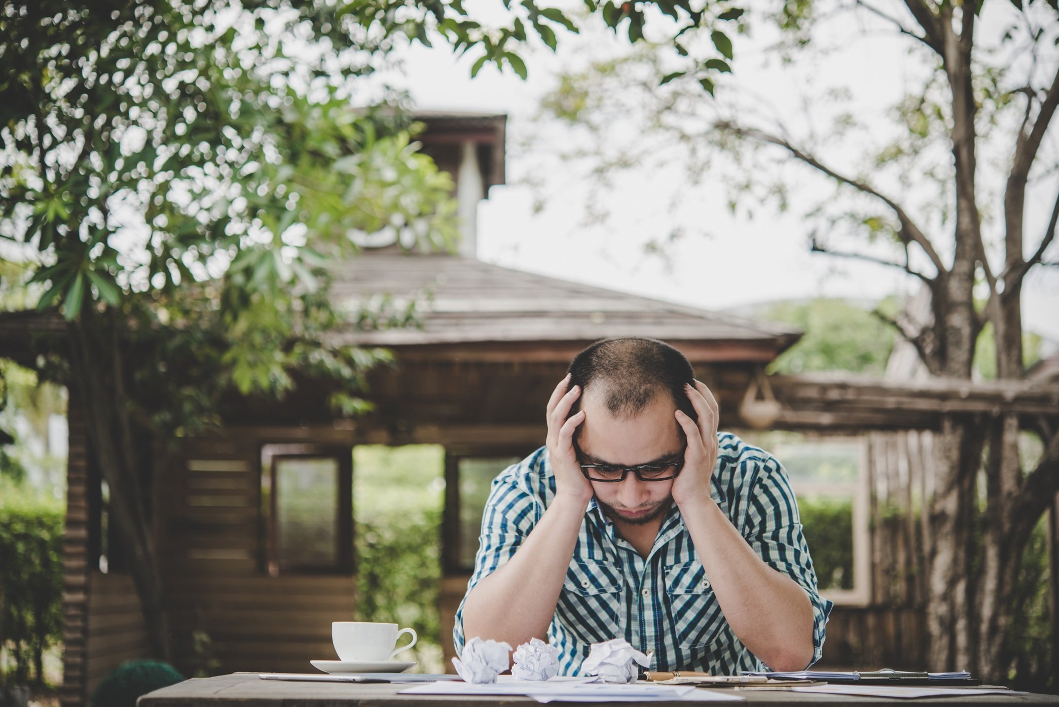 stressed-businessman-with-papers-and-charts-sittin-2026-03-17-01-36-27-utc