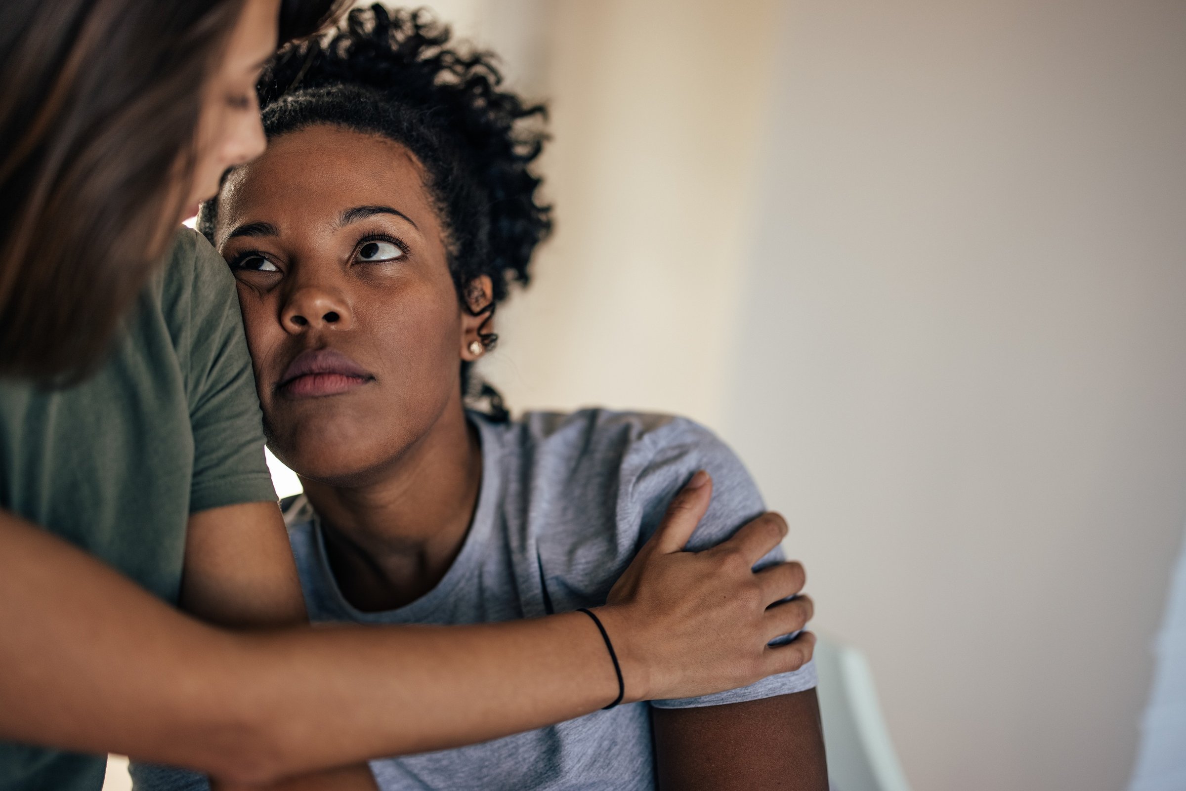 supportive-woman-comforting-a-friend-indoors-2026-03-20-04-12-14-utc