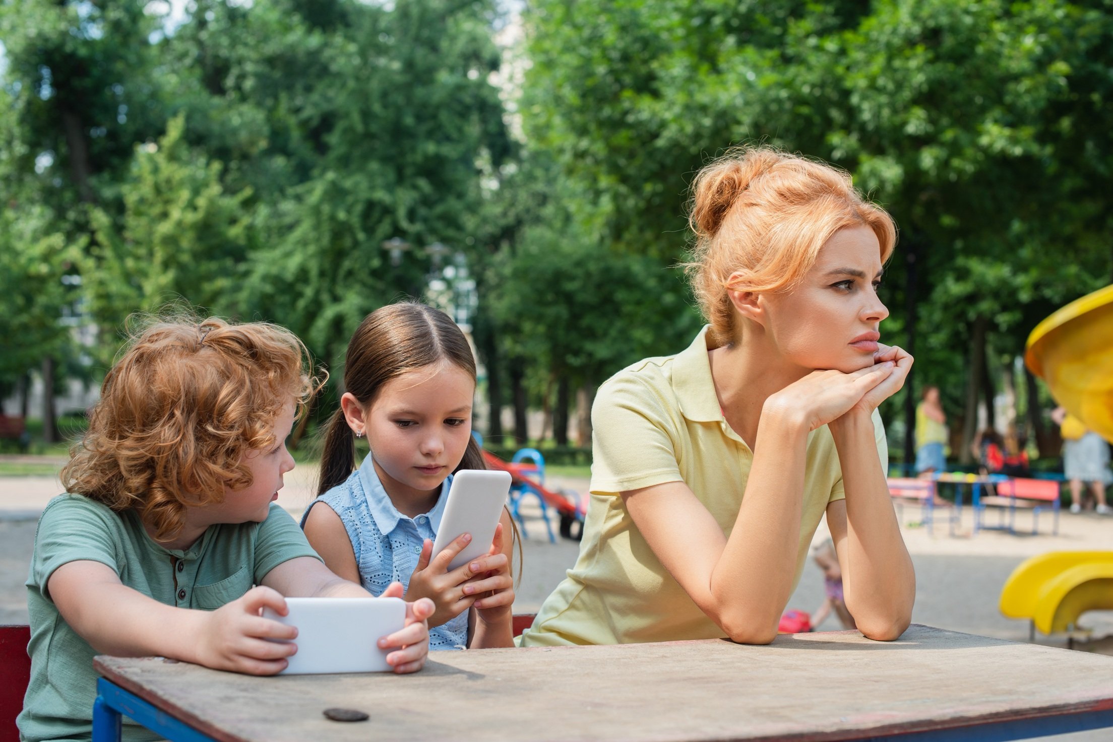thoughtful-and-sad-woman-looking-away-near-childre-2026-03-11-04-21-15-utc