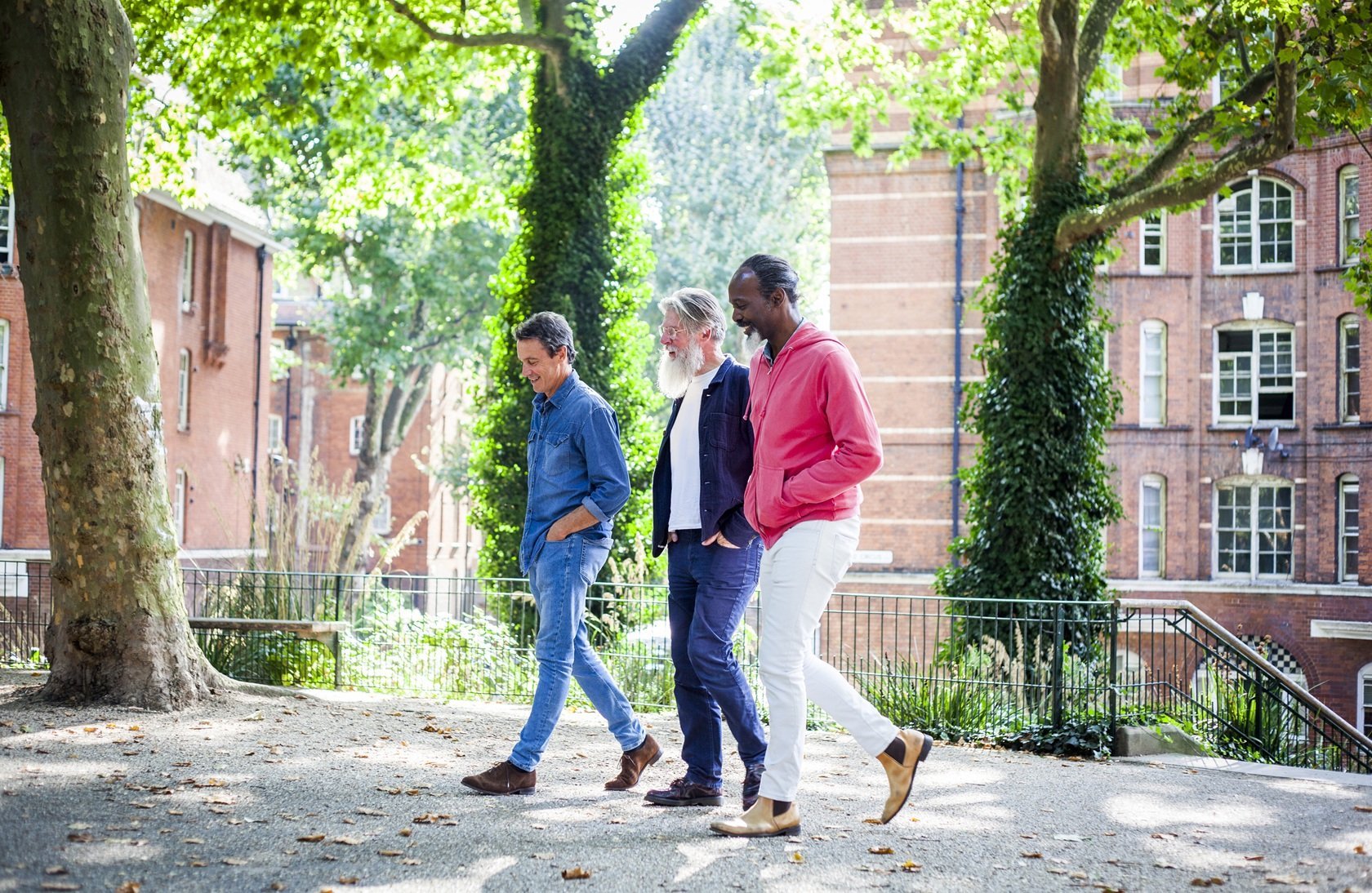 three-mature-men-walking-in-street-2026-03-25-02-15-42-utc