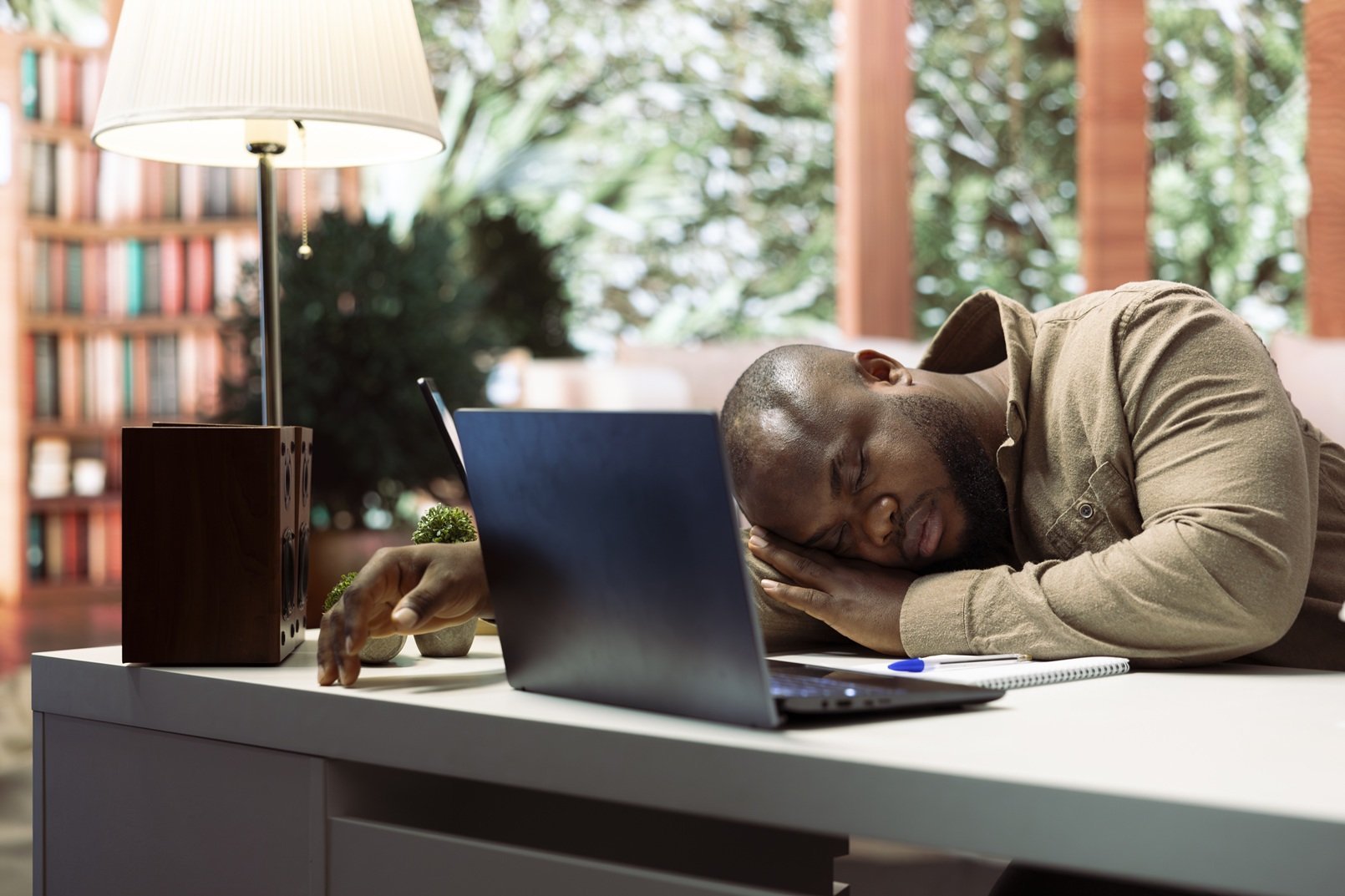 tired-man-sleeping-at-desk-in-office-2026-03-26-23-27-40-utc