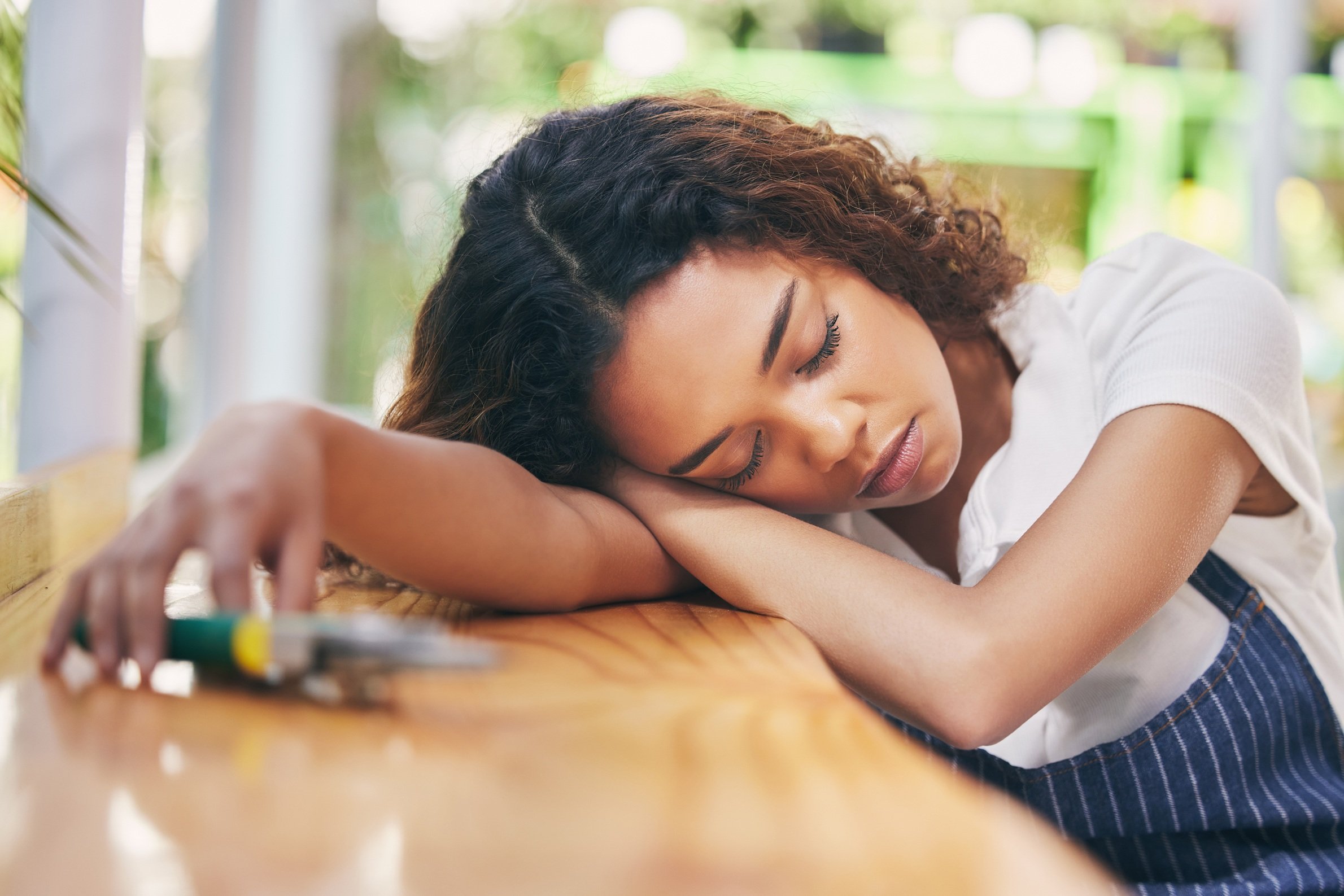 tired-woman-sleeping-at-desk-during-daytime-2026-01-09-10-41-54-utc