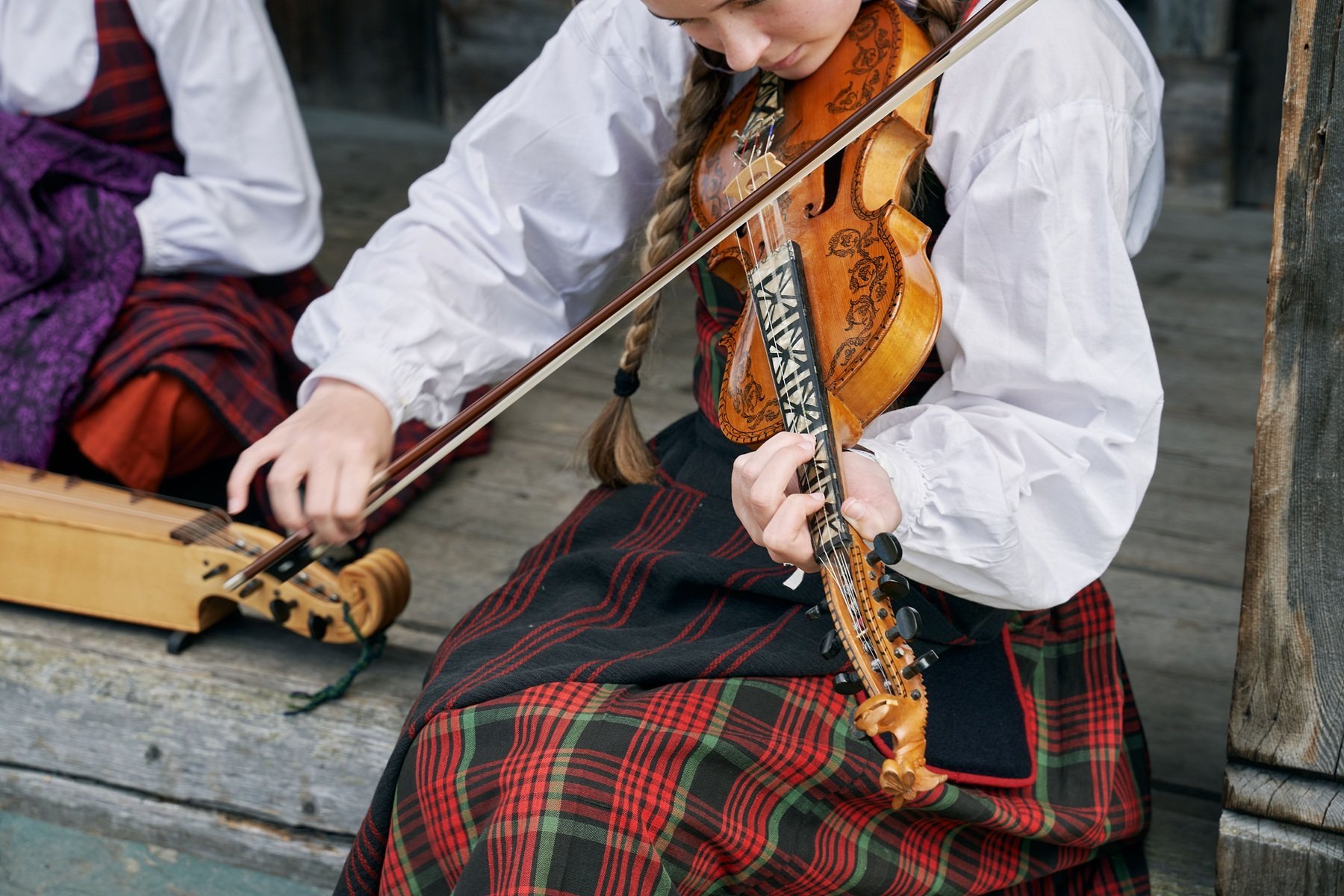 woman-playing-a-violin-in-valdres-folk-museum-and-2026-03-18-05-43-28-utc