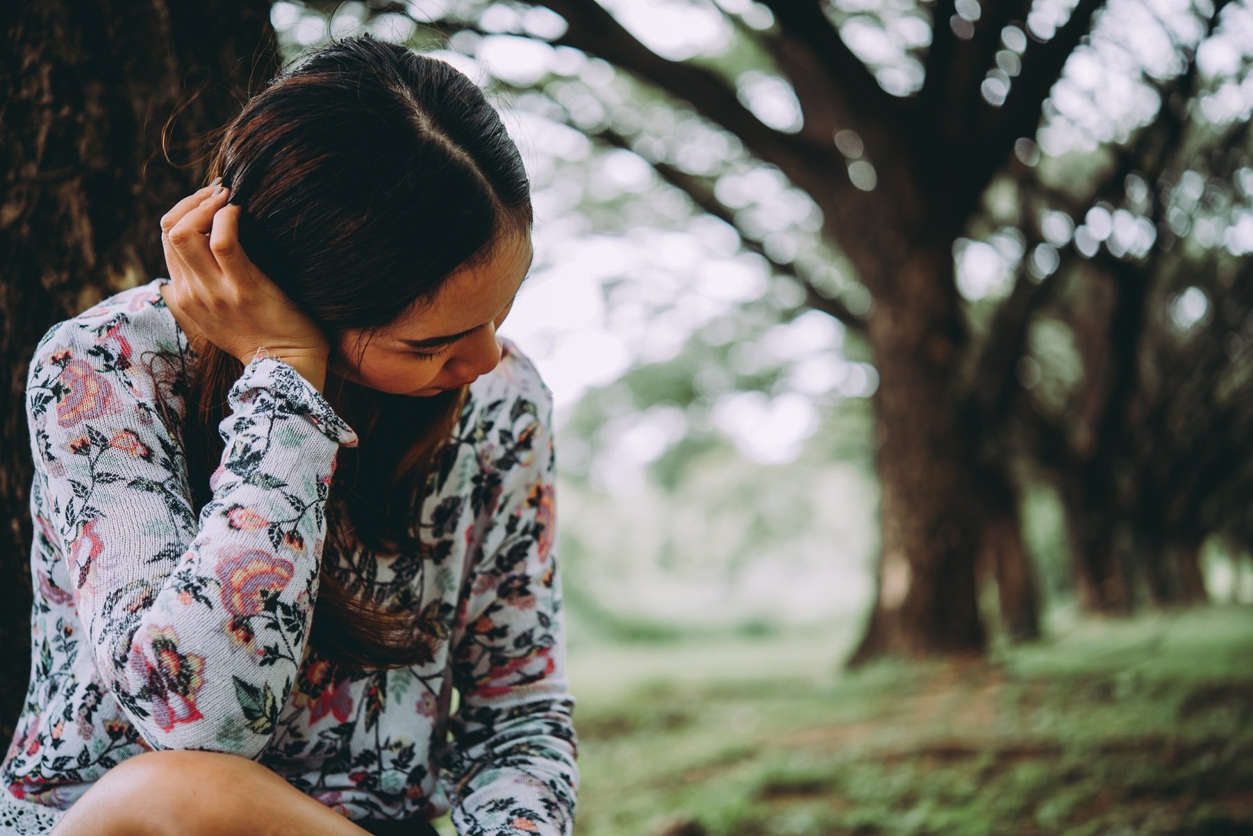 woman-relaxing-in-a-field-of-trees-2026-03-26-22-49-38-utc